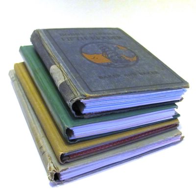 A stack of journals from vintage books.