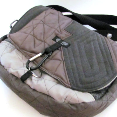 Clip closure on the front of this messenger bag